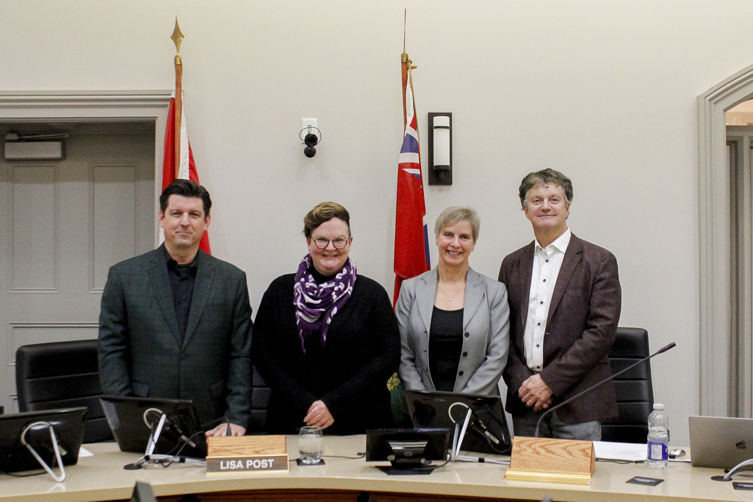 Members of the Police Services Board standing in the Orangeville Town Hall Council Chambers